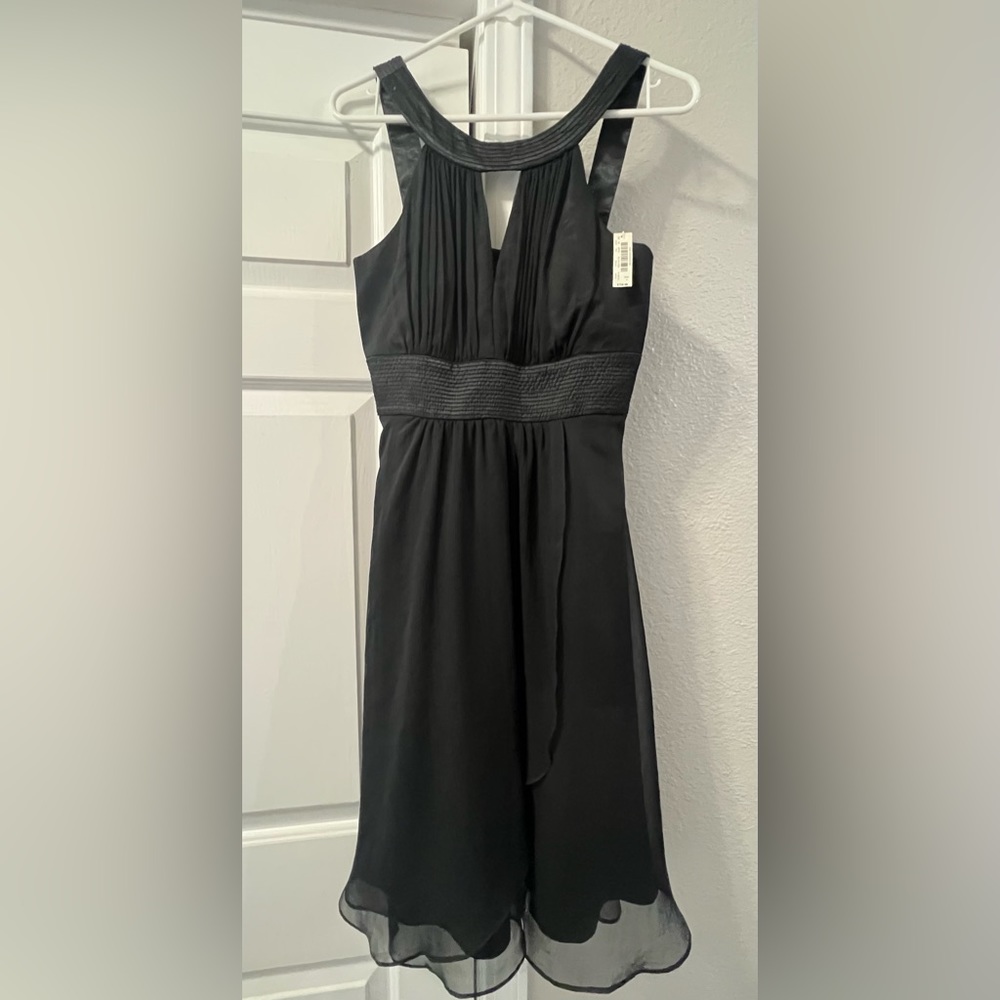 Black dress. Great for holiday parties. Size 4. NWT WHBM.